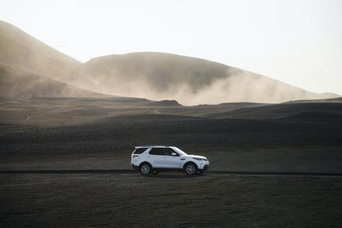 2019, Iceland, White Landrover driving on a dusty sand road - 1227105