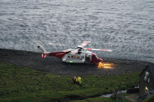 Coastguard helicopter landing on the island in Scotland - 1233409