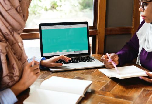 Islamic women discussing and using laptop for working - 400005