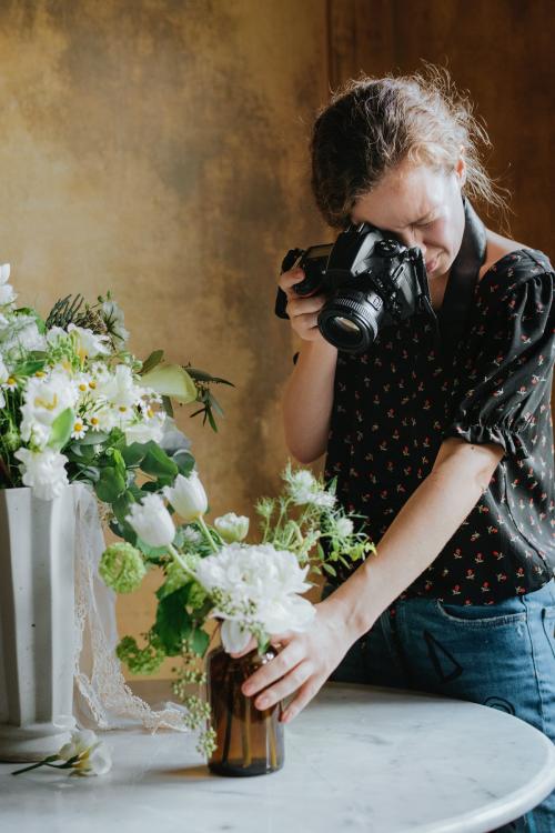 Photographer taking a photo of a bouquet - 1207850