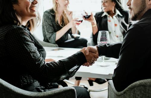 Businesswoman shaking hands with a partner - 1211530