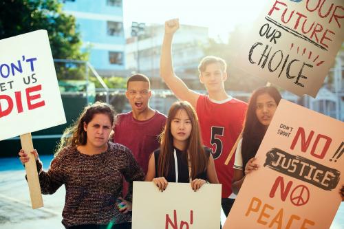 Group of teenagers protesting demonstration holding posters antiwar justice peace concept - 401498