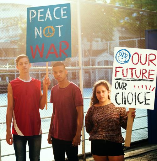 Group of diverse teenagers protesting anti war - 401522