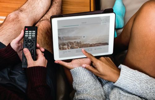 Couple checking music playlist on tablet - 404398