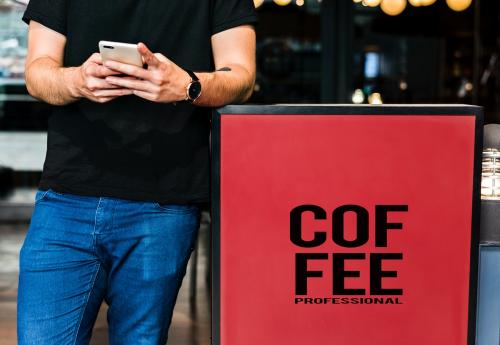 Young man waiting at a coffee shop - 404489