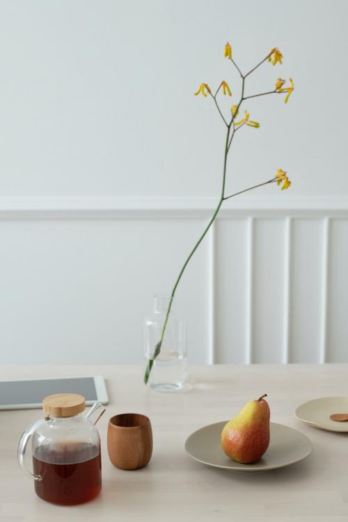 Coffee and pear on a wooden table - 1212735