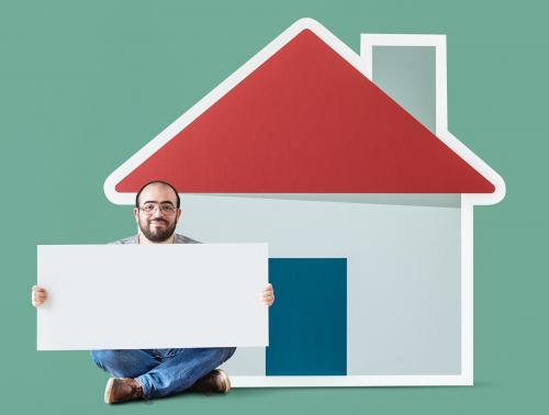 Man holding poster with house mockup - 404808