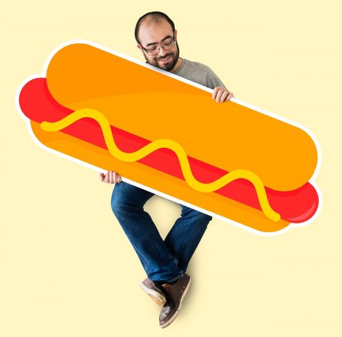 Man holding a big hot dog - 404892