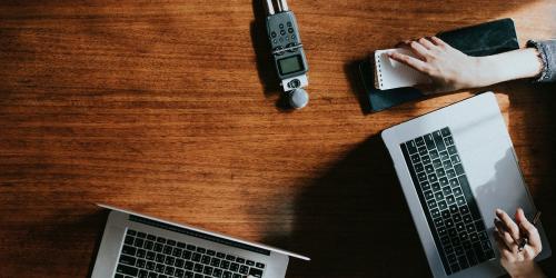 Portable sound recorder on a wooden table - 1225449