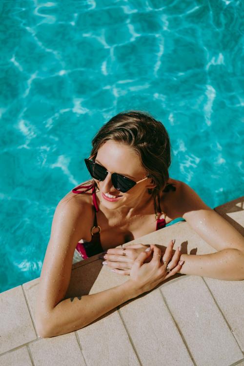 Cheerful woman in a pool - 1228440