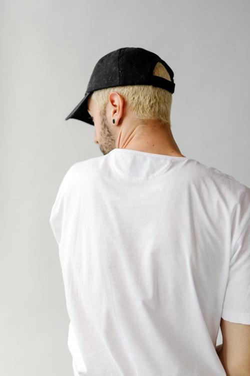 Rearview of a man in a white tee - 1235421