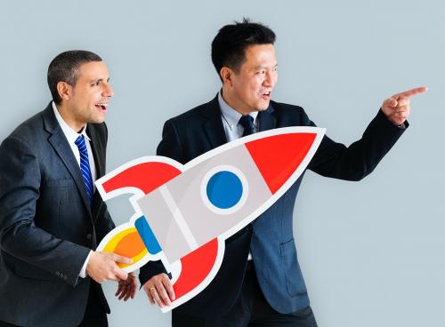 Businessmen holding launching rocket icon - 414615