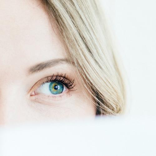 Closeup of woman with a blue eye - 1208444