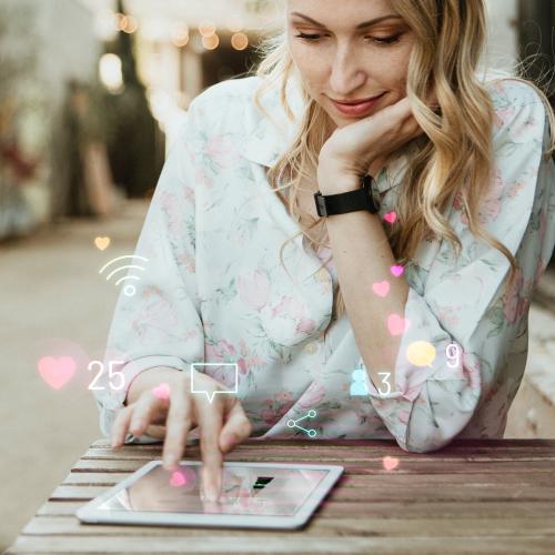 Happy woman using social media on a tablet - 1208521