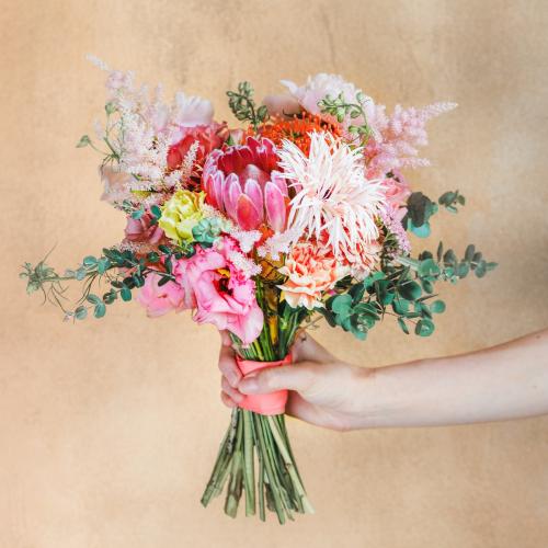 Woman holding a bouquet of flowers - 1207089