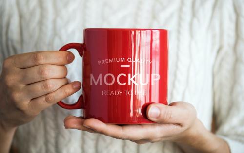 Hands holding a red mockup mug - 296408