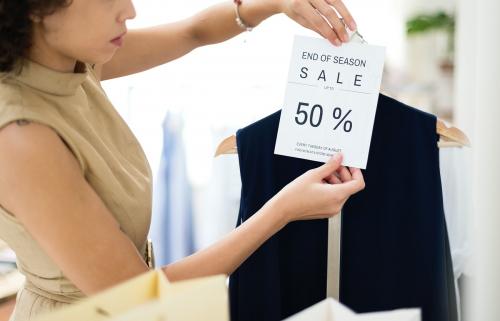 Woman with 50 percent sale sign - 259216