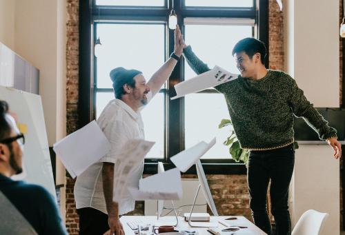 Happy businessmen doing a high five - 1213751