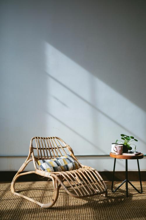 Wicker seat by a window - 1213788