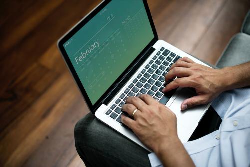 Close up of person working on laptop - 259937