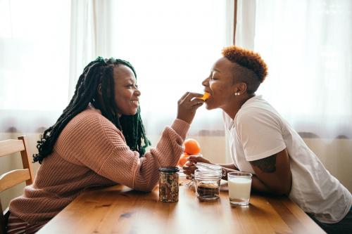 Happy gay couple having breakfast - 1205363