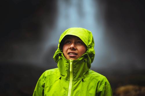 Woman in a green jacket at the Haifoss waterfall, Iceland - 1205982