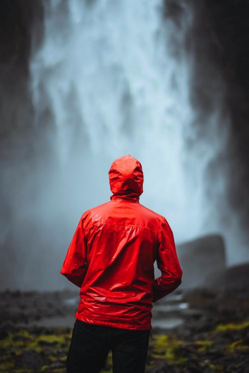 Man in a red windbreaker at the Haifoss waterfall, Iceland - 1206006