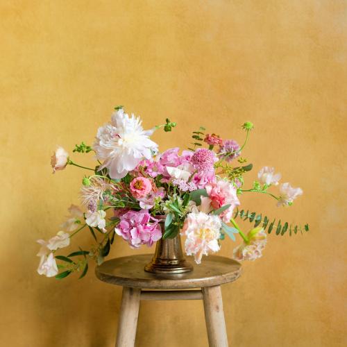 Flowers in a vase on a stool - 1207101