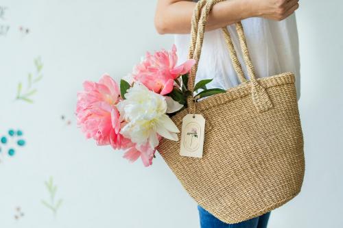 Beautiful peonies in a wicker bag - 1207622