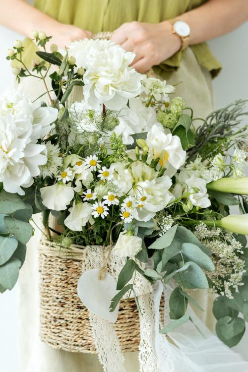 Woman holding a bouquet of white flowers - 1207813