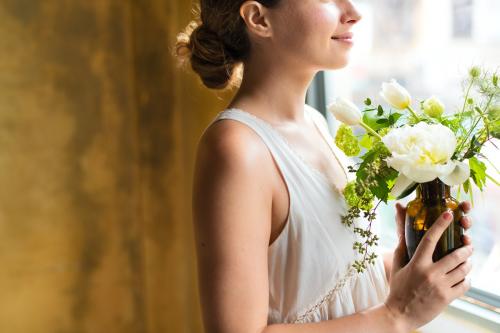 Woman holding a bouquet of white flowers - 1209203