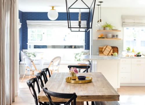 Golden kitchen tray on a wooden dining table - 1211442