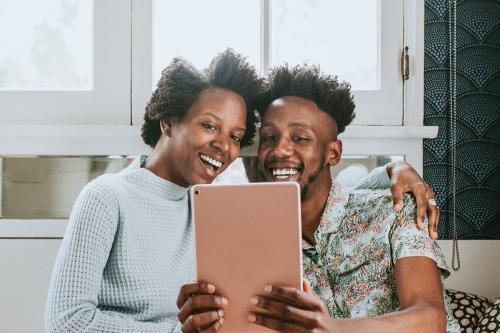 Black couple using a tablet together - 1211622