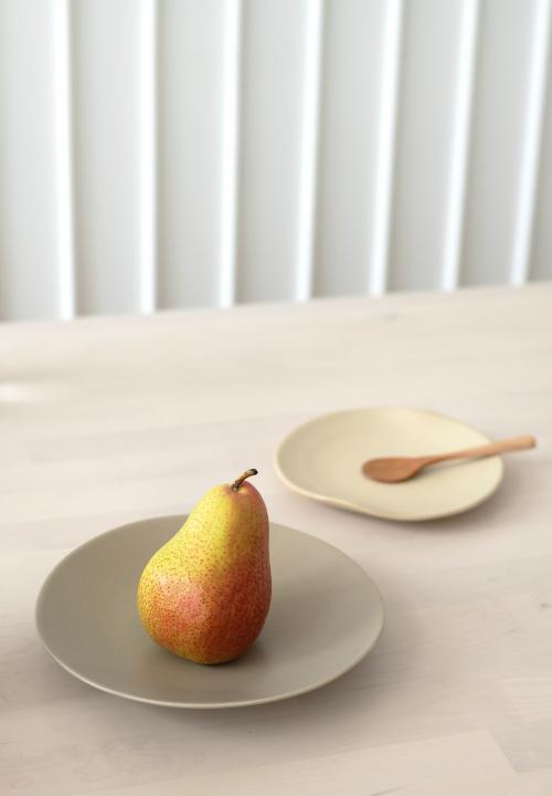 A fresh pear on a wooden table - 1212588