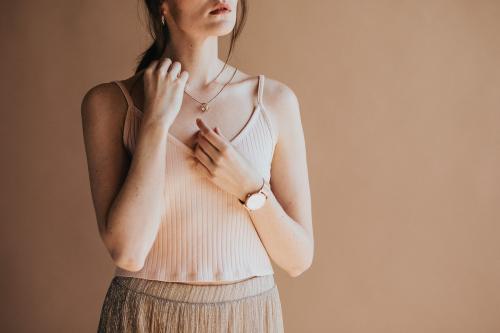 Woman in a light pink tank top - 1216459