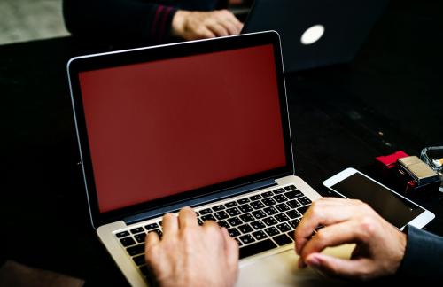 Closeup of hand with computer laptop background - 50118