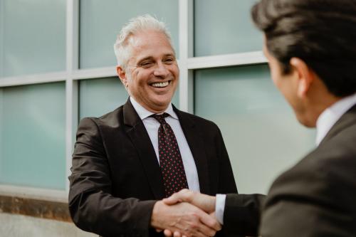 Businessmen making a business deal - 1199597