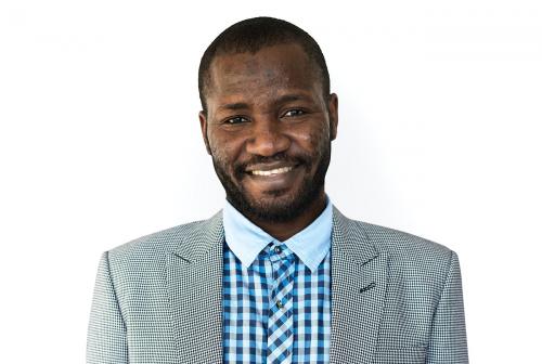 African man mustache smiling studio portrait - 7578