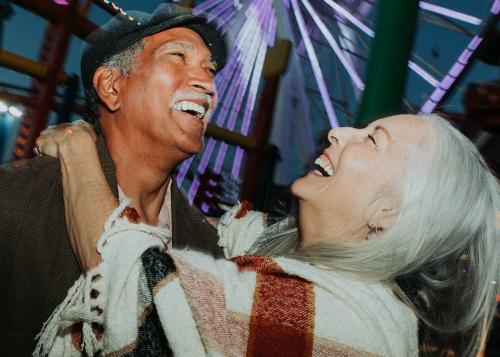 Cheerful elderly couple at Pacific Park in Santa Monica, California - 1202562