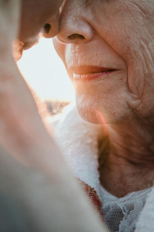 Romantic senior couple by the pier - 1202613