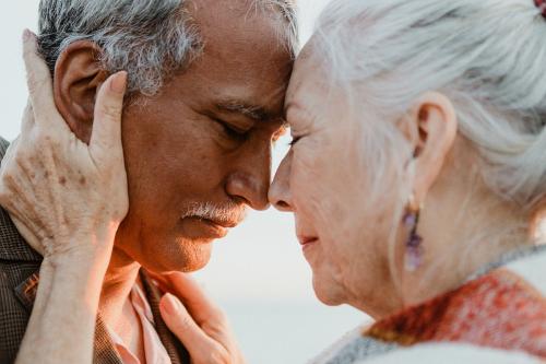 Romantic senior couple by the pier - 1202663