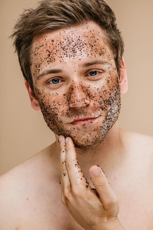 Man doing a face scrub - 1203350