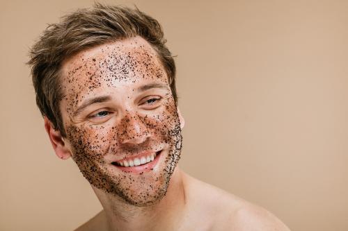 Happy man scrubbing his face - 1203366