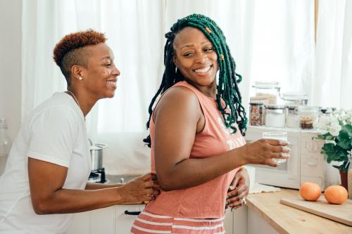 Happy gay couple in the kitchen - 1205307