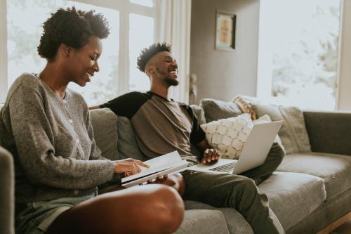 Cheerful black people using a laptop - 1211724