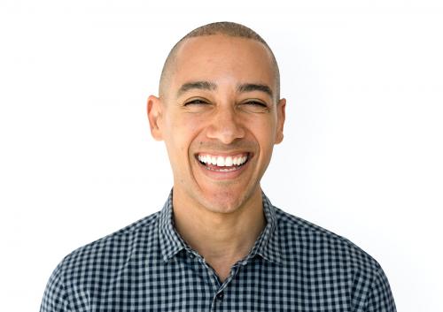 Skinhead man wearing checkered shirt studio shoot and smiling - 7133