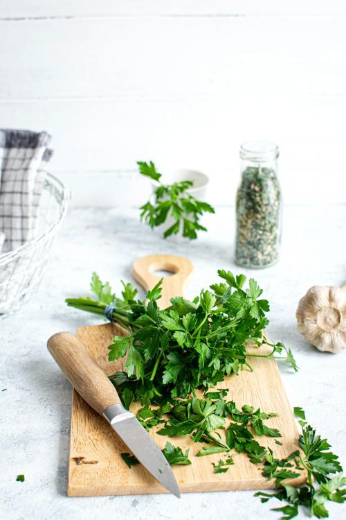 Fresh organic parsley on a wooden cutting board - 1215672