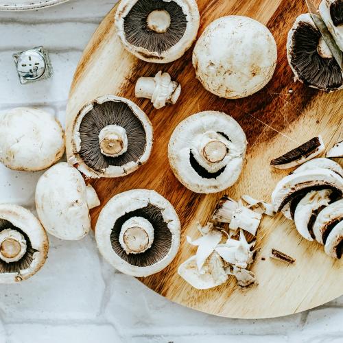 Prepared fresh mushrooms on a cutting board food photography - 1054324