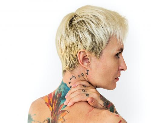 Portrait of a woman showing off her back tattoos - 7253