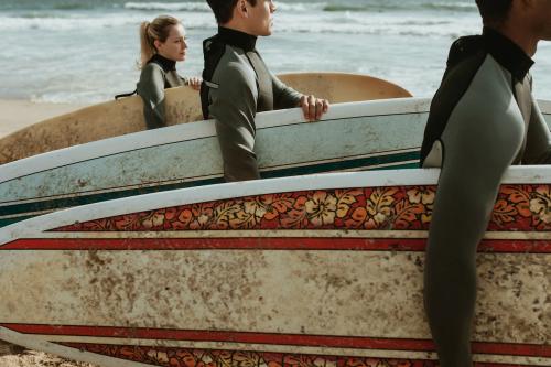 Surfers at the beach on a sunny day - 1079779